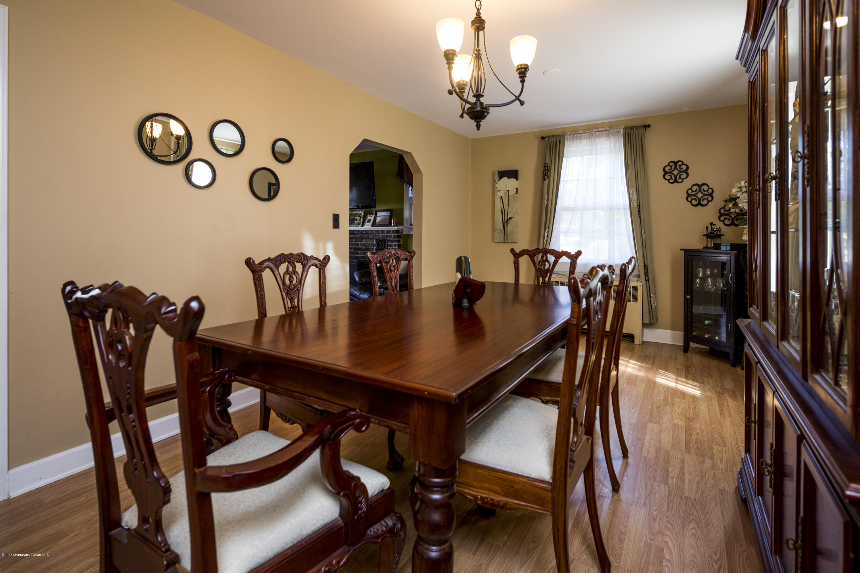 167 Newman Springs Road Tinton Falls, NJ 07724 - Photo 5 of 23 a view of a dining room with furniture and wooden floor