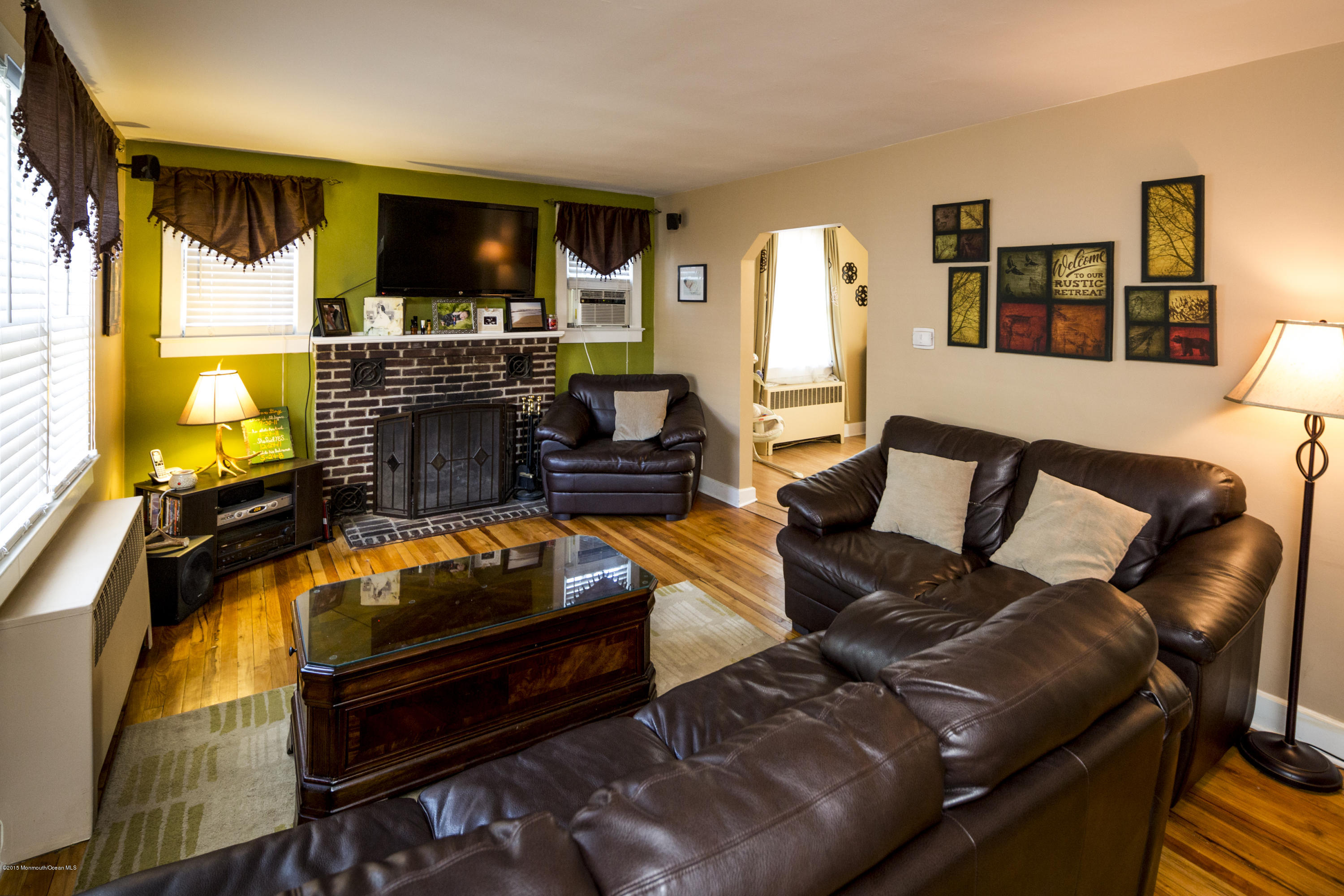 167 Newman Springs Road Tinton Falls, NJ 07724 - Photo 7 of 23 a living room with furniture a flat screen tv and kitchen view