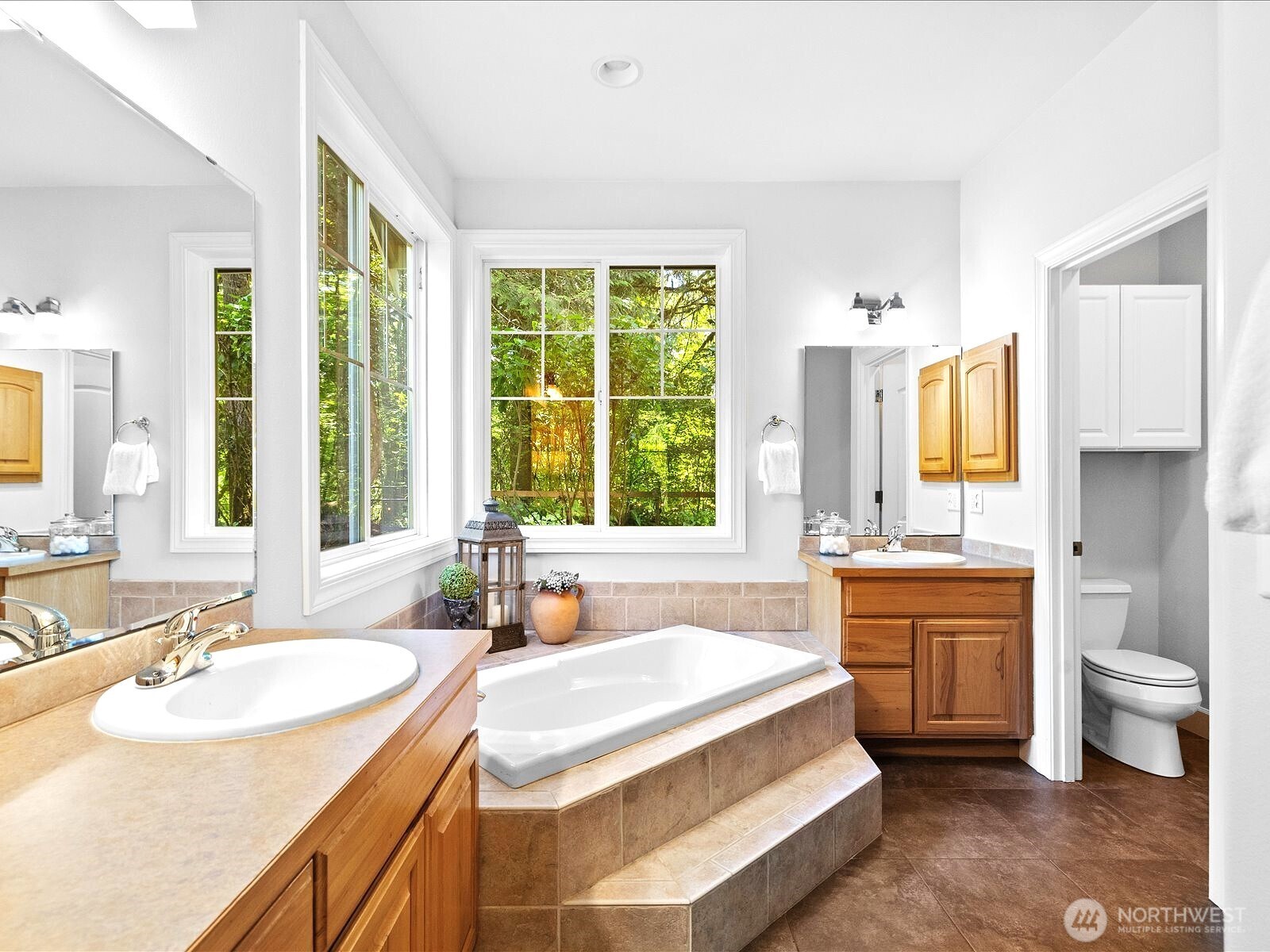 33606 Northeast Lake Joy Road Carnation, WA 98014 - Photo 20 of 40 a spacious bathroom with a granite countertop sink and a large mirror