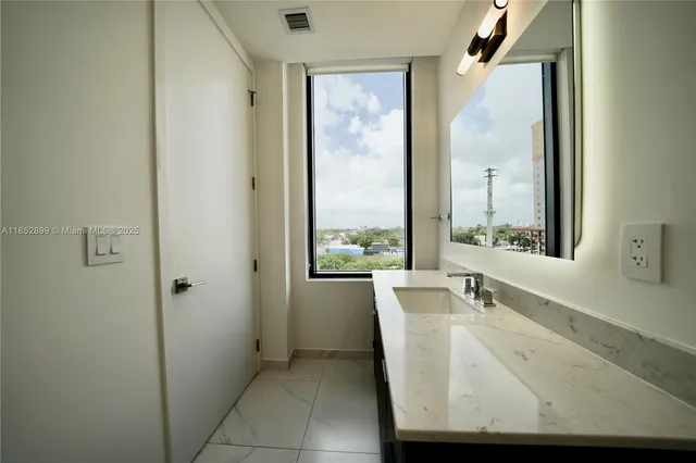 a bathroom with a bathtub and a sink