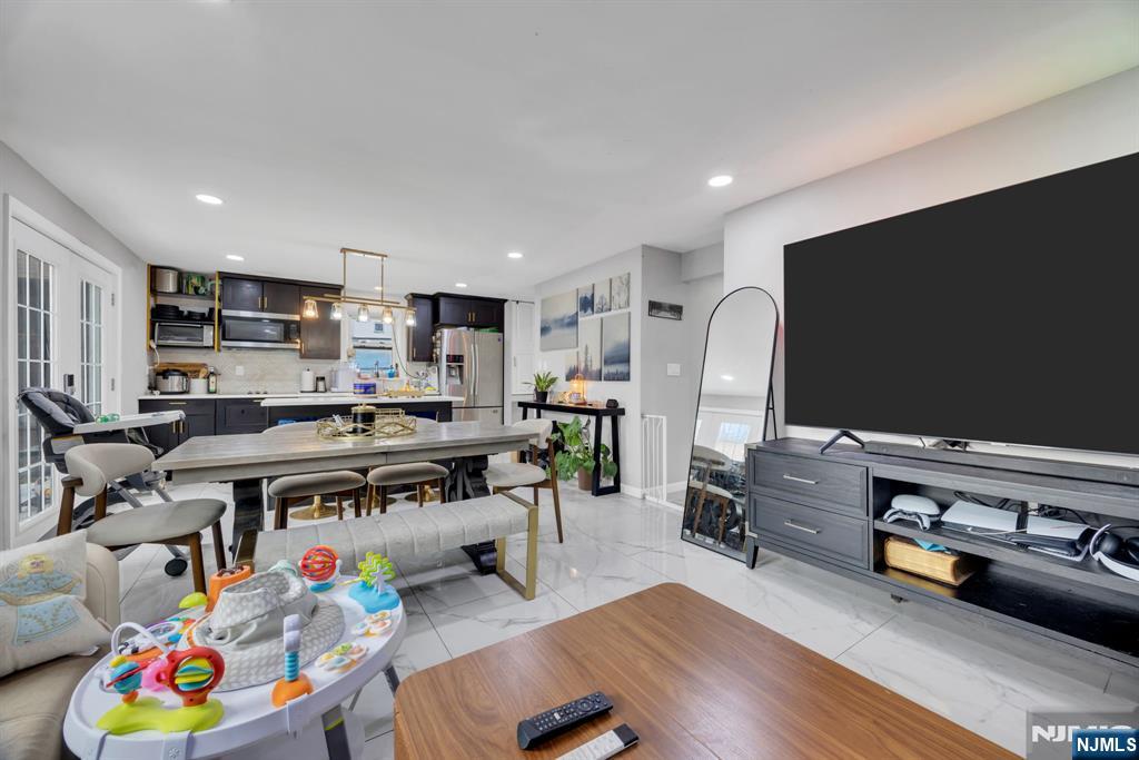241 Orange Street Dunellen, NJ 08812 - Photo 11 of 35 a living room with furniture and a flat screen tv