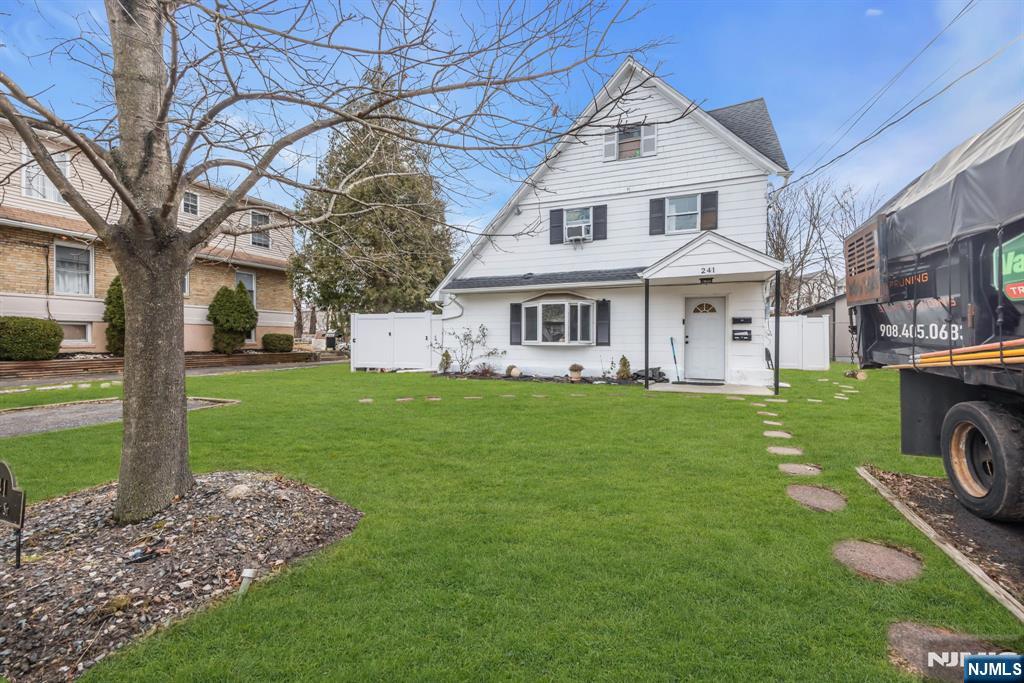 241 Orange Street Dunellen, NJ 08812 - Photo 2 of 35 a front view of a house with garden