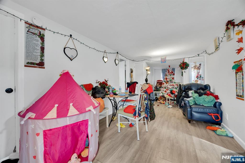 241 Orange Street Dunellen, NJ 08812 - Photo 25 of 35 a group of people sitting in a room