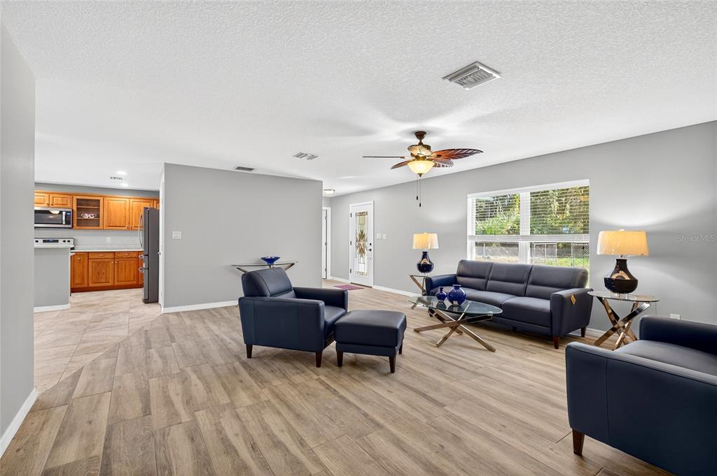 201 West Street Interlachen, FL 32148 - Photo 15 of 43 a living room with furniture and a window
