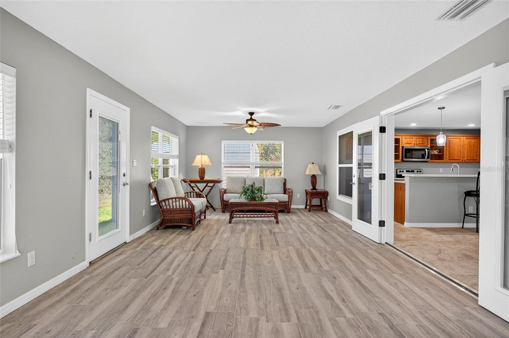 201 West Street Interlachen, FL 32148 - Photo 24 of 43 a living room with furniture and a wooden floor