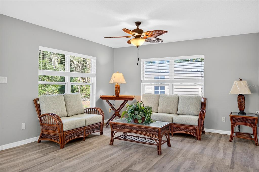 201 West Street Interlachen, FL 32148 - Photo 26 of 43 a living room with furniture and a large window