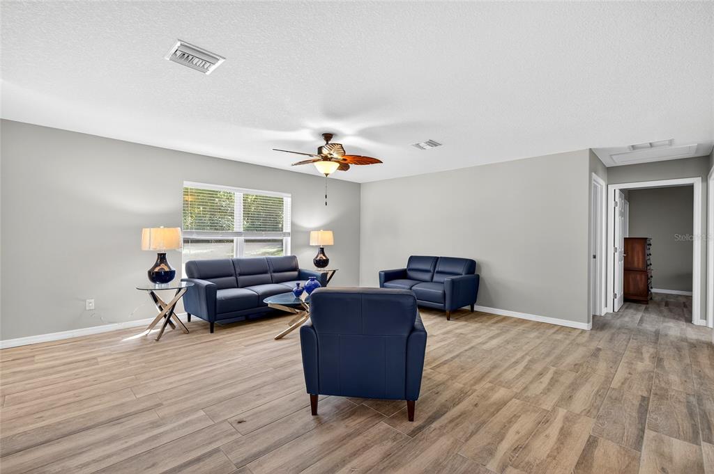 201 West Street Interlachen, FL 32148 - Photo 28 of 43 a living room with furniture and a wooden floor