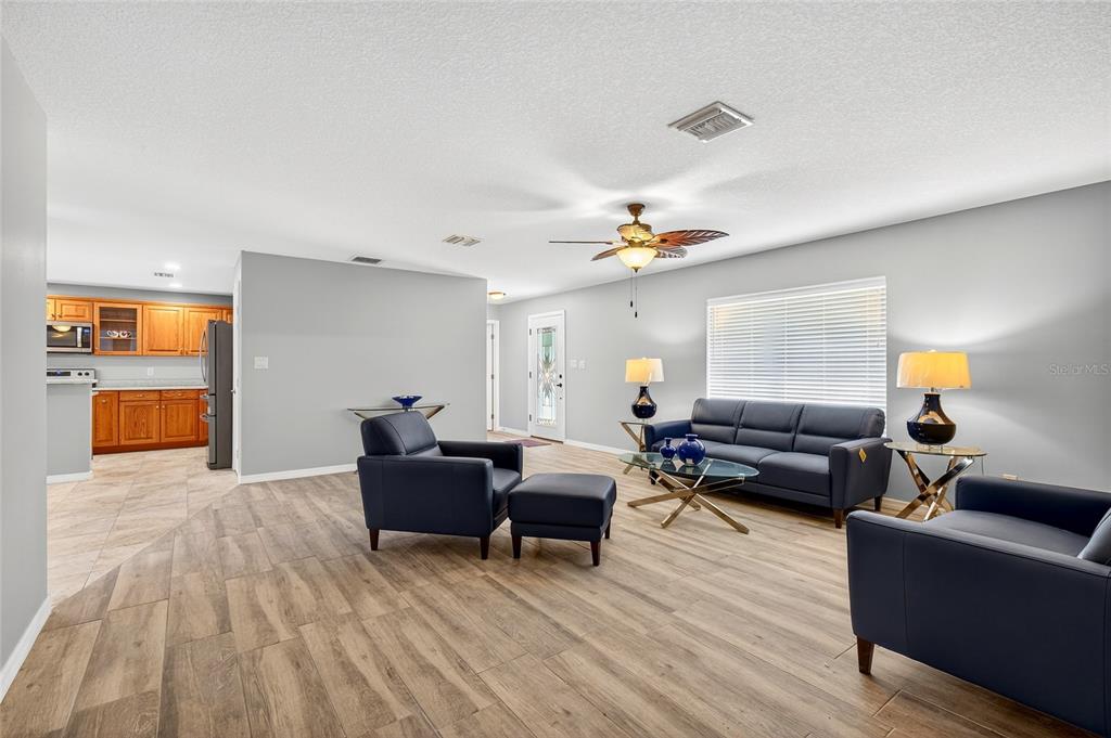 201 West Street Interlachen, FL 32148 - Photo 34 of 43 a living room with furniture and a wooden floor