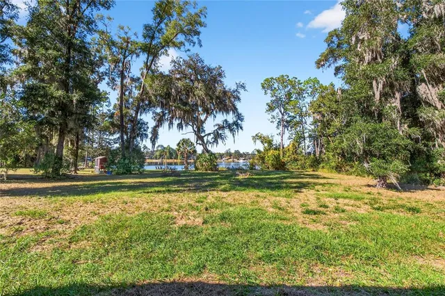 a view of a lake with a big yard