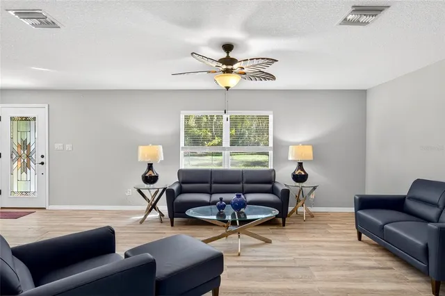 a living room with furniture and a window