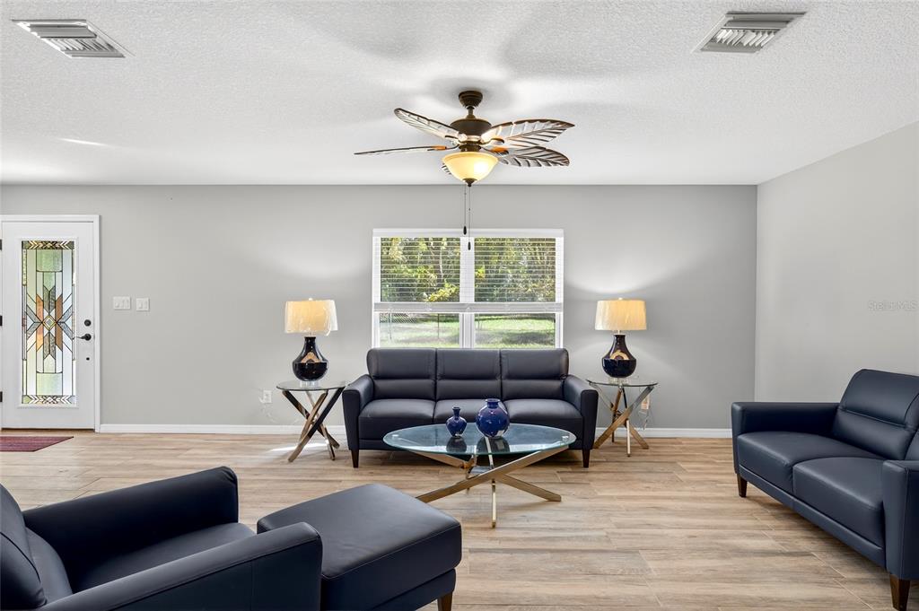 201 West Street Interlachen, FL 32148 - Photo 7 of 43 a living room with furniture and a window