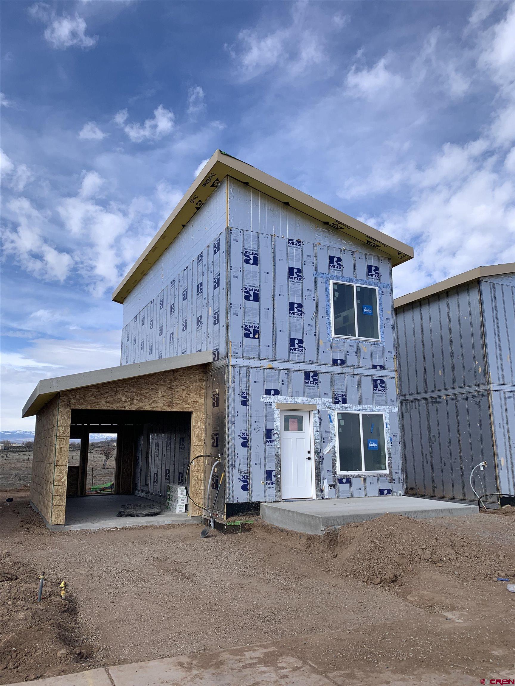 250 Manzano Circle Ignacio, CO 81137 - Photo 5 of 12 a front view of a house with a garage