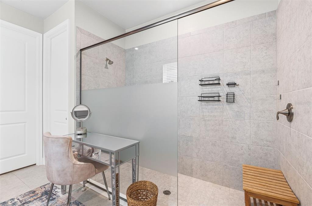 20380 Symphony Place Venice, FL 34293 - Photo 17 of 56 a bathroom with a shower
