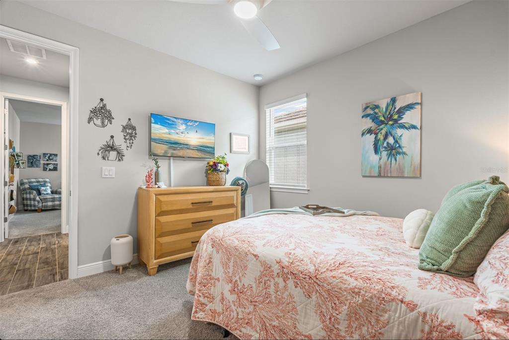 20380 Symphony Place Venice, FL 34293 - Photo 24 of 56 a bedroom with a bed and a furniture