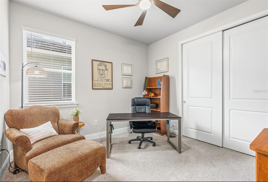 20380 Symphony Place Venice, FL 34293 - Photo 25 of 56 a living room with furniture and a window
