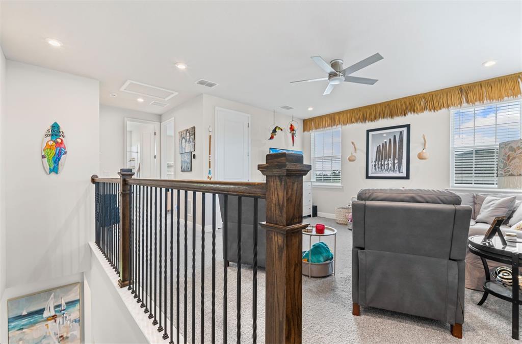 20380 Symphony Place Venice, FL 34293 - Photo 29 of 56 a living room with furniture and a chandelier