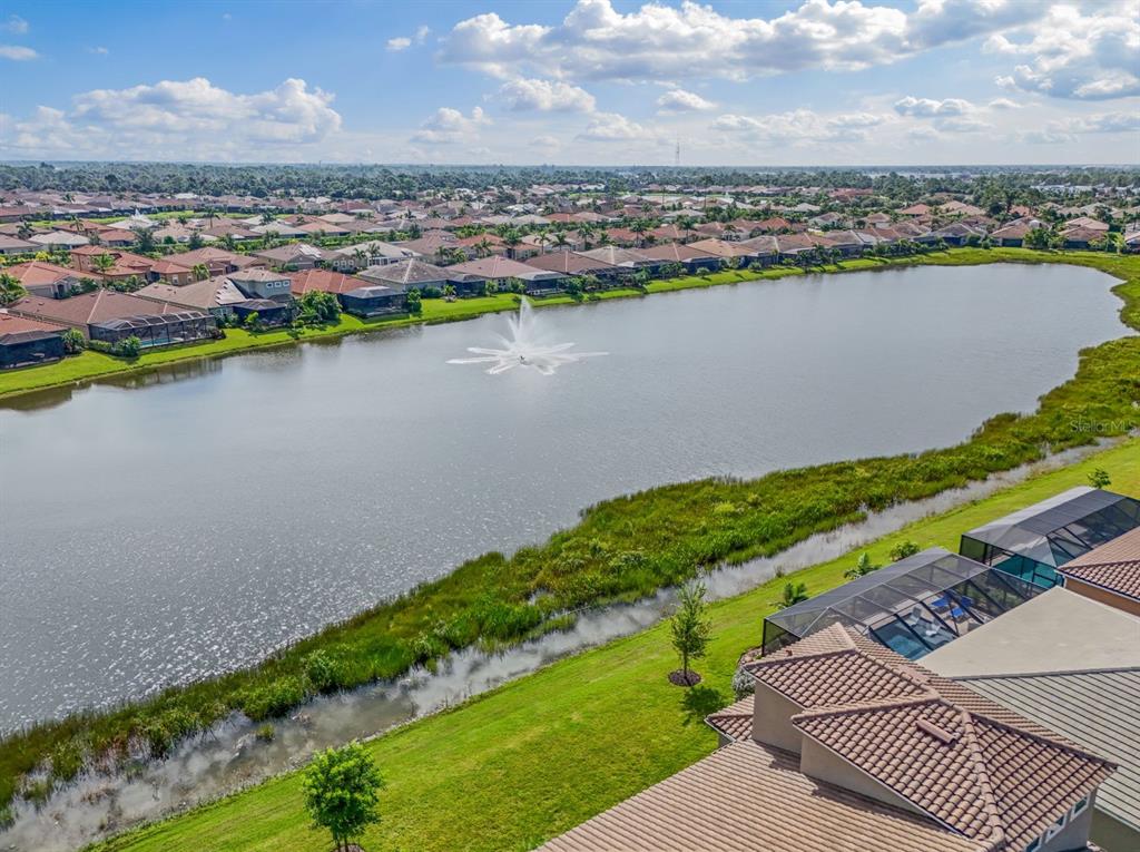 20380 Symphony Place Venice, FL 34293 - Photo 35 of 56 an aerial view of a city with a lake view