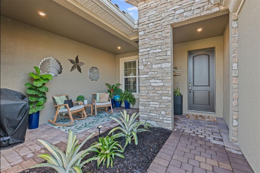20380 Symphony Place Venice, FL 34293 - Photo 4 of 56 a front view of a house with garden