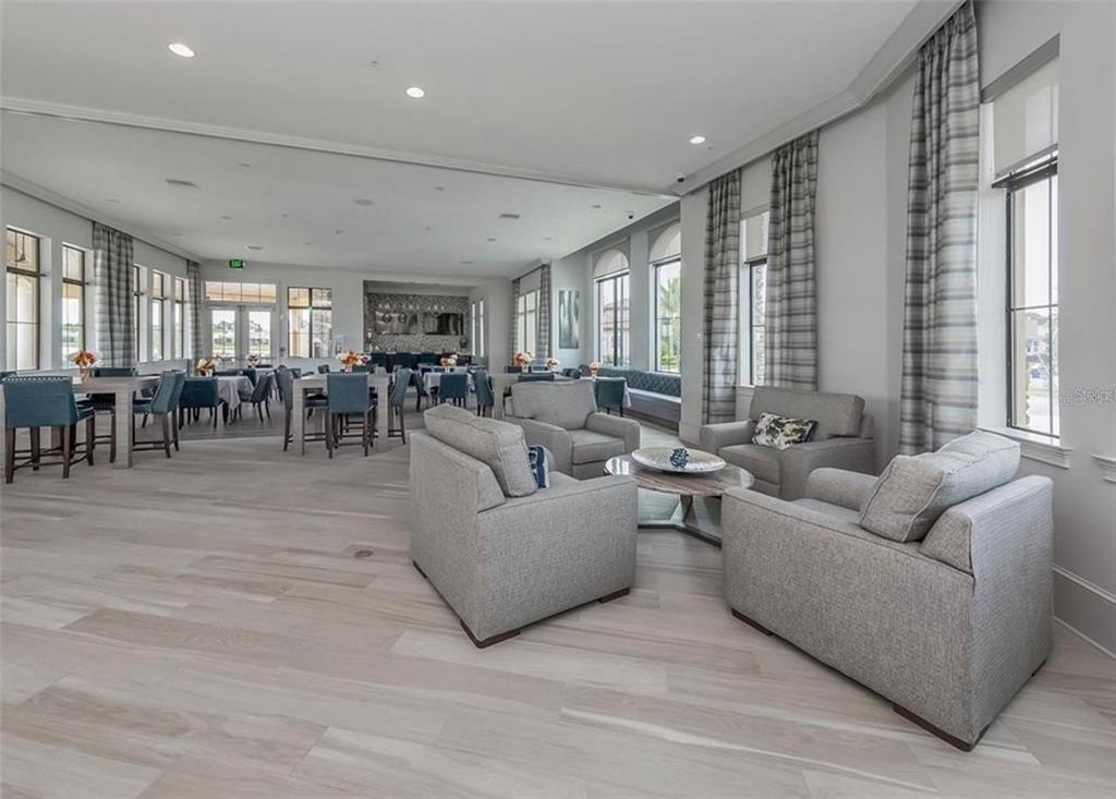 20380 Symphony Place Venice, FL 34293 - Photo 41 of 56 a living room with furniture and a large window