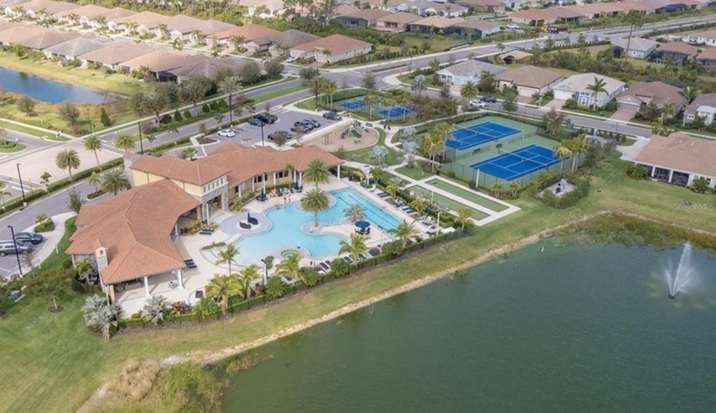 20380 Symphony Place Venice, FL 34293 - Photo 52 of 56 an aerial view of residential houses with outdoor space