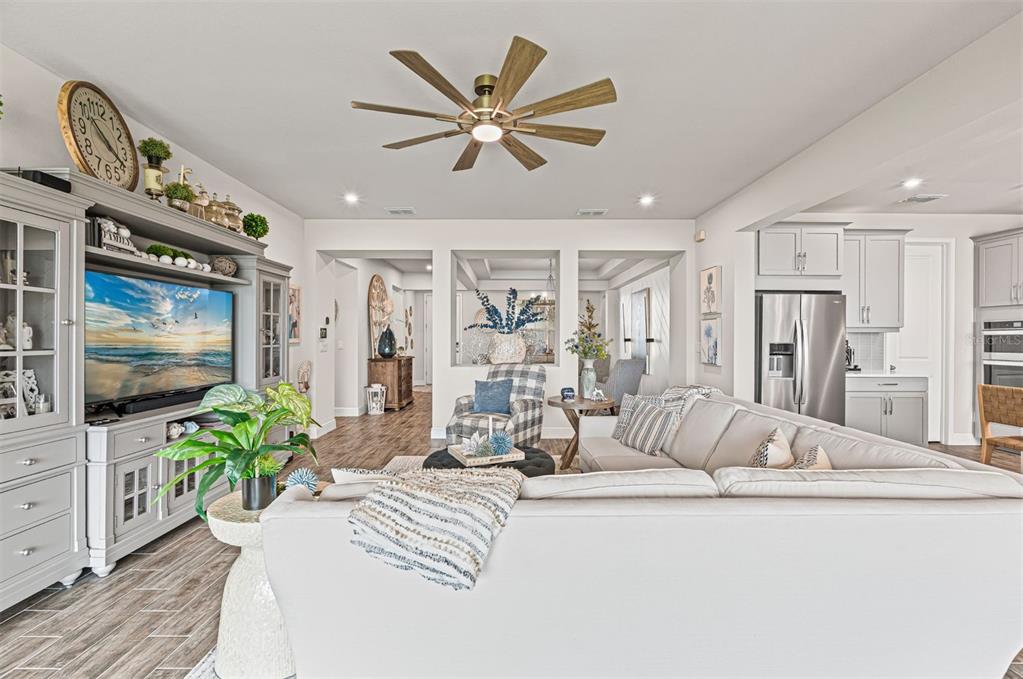 20380 Symphony Place Venice, FL 34293 - Photo 9 of 56 a living room with furniture fireplace and flat screen tv