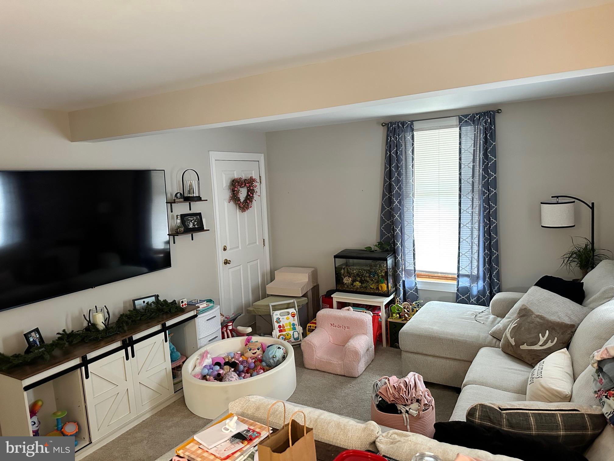 152 North Main Street Chalfont, PA 18914 - Photo 12 of 19 a bedroom with furniture and a flat screen tv