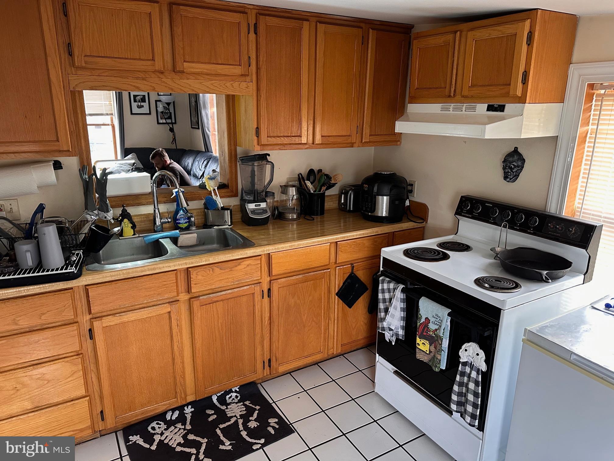 152 North Main Street Chalfont, PA 18914 - Photo 14 of 19 a kitchen with stainless steel appliances a stove a sink and cabinets