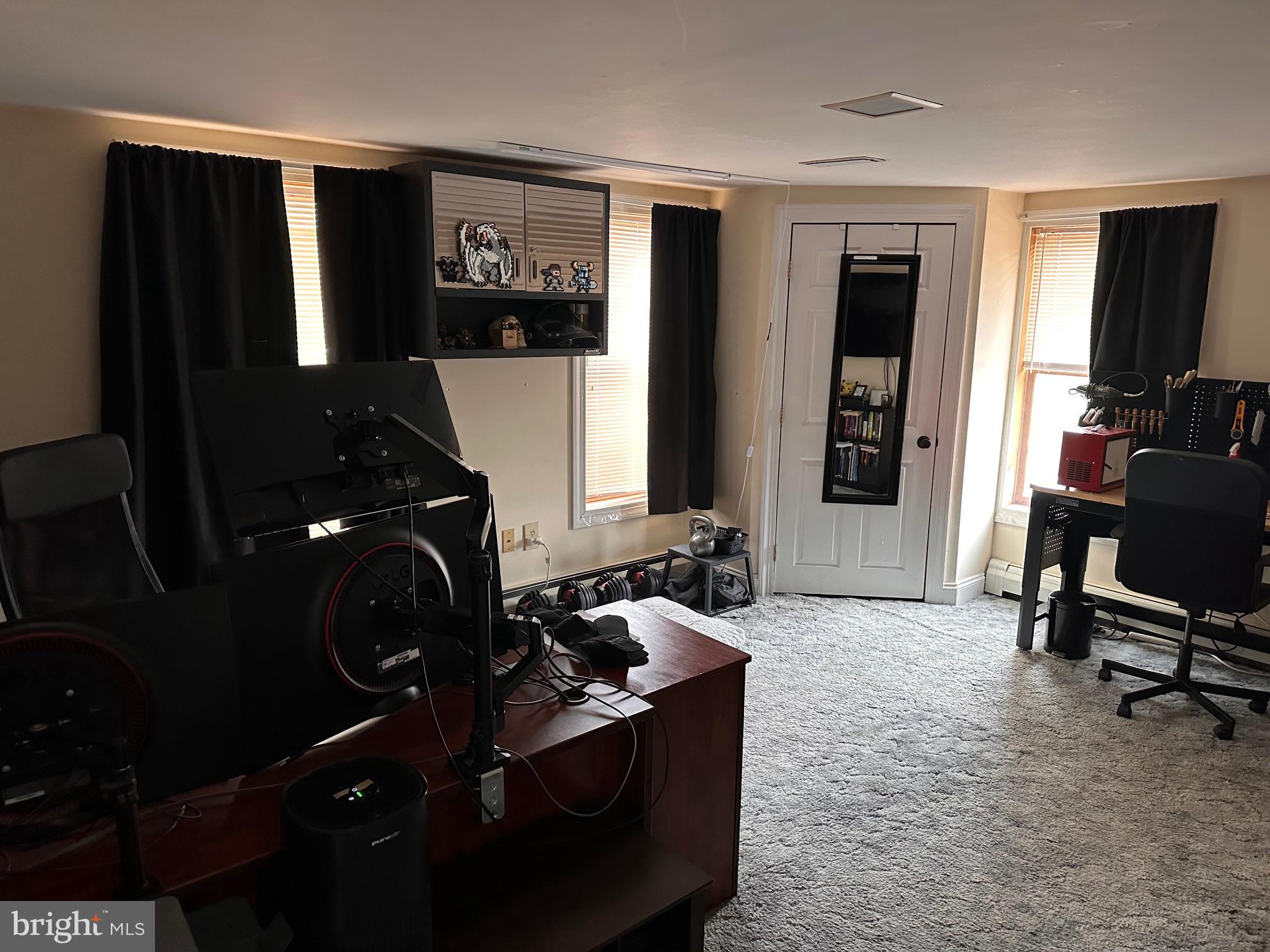 152 North Main Street Chalfont, PA 18914 - Photo 19 of 19 a room with furniture a flat screen tv and a window