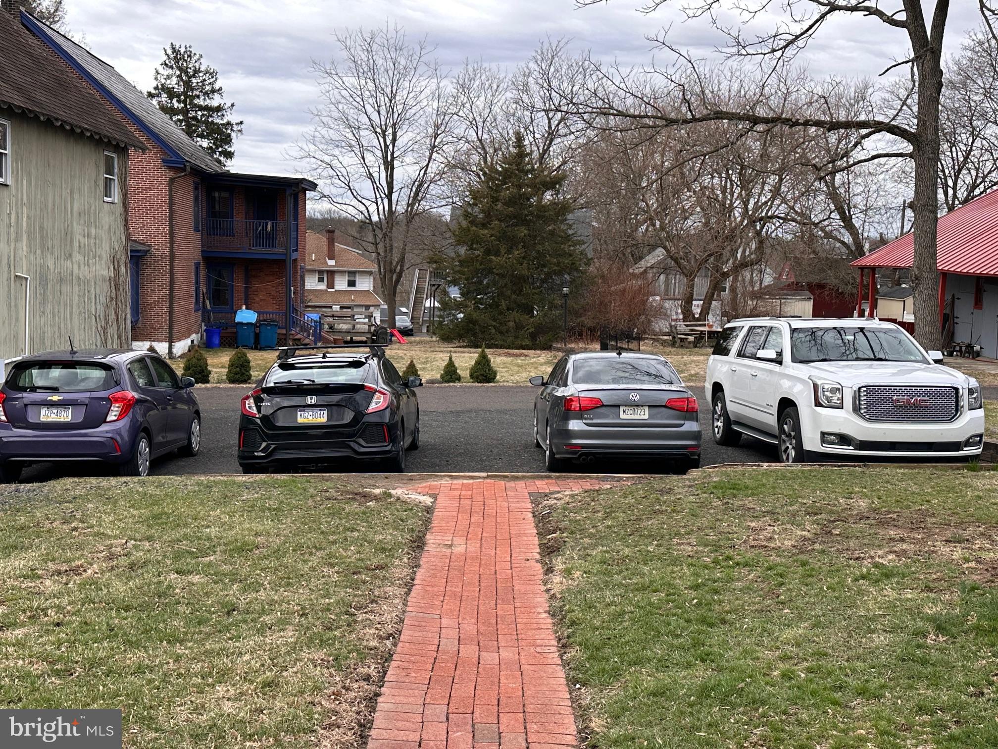 152 North Main Street Chalfont, PA 18914 - Photo 6 of 19 a view of a cars park in front of a building