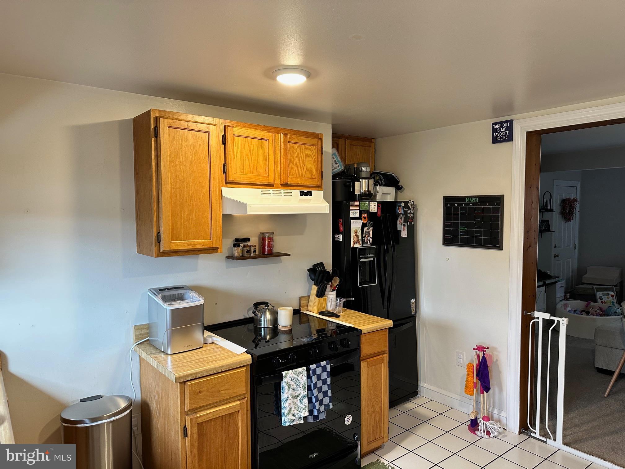152 North Main Street Chalfont, PA 18914 - Photo 7 of 19 a kitchen with stainless steel appliances a sink a stove a refrigerator and cabinets