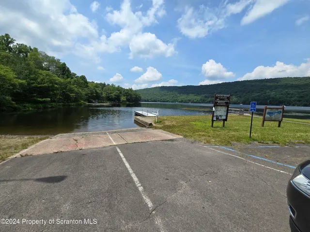 a view of a lake with a yard