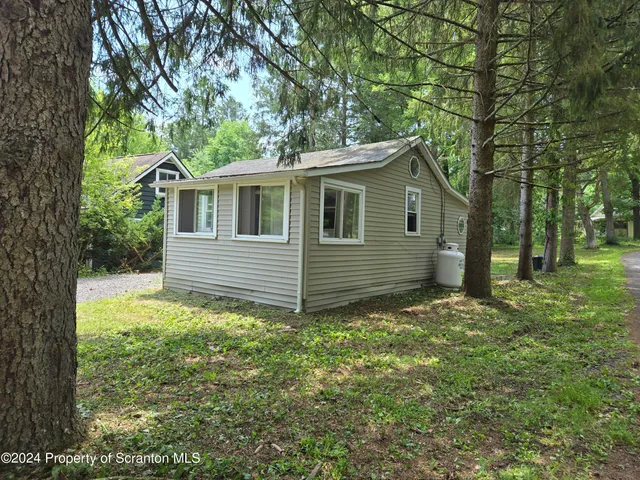 a house with trees in front of it