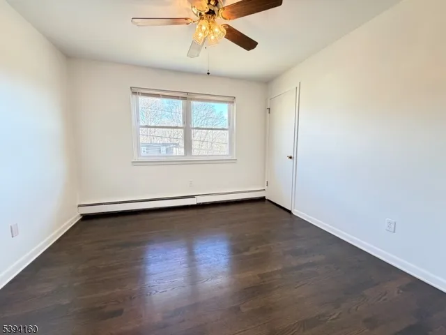 a view of a house with a yard next to a road