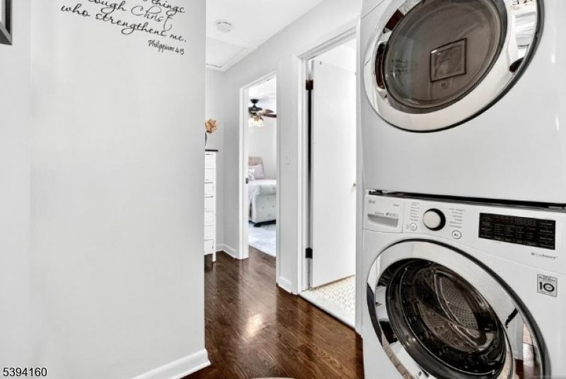 61 Star Lake Road, Unit 2 Bloomingdale, NJ 07403 - Photo 13 of 18 a view of a hallway with washer and dryer