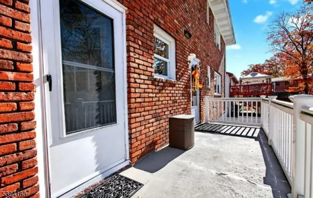 a view of a balcony with a potted plant