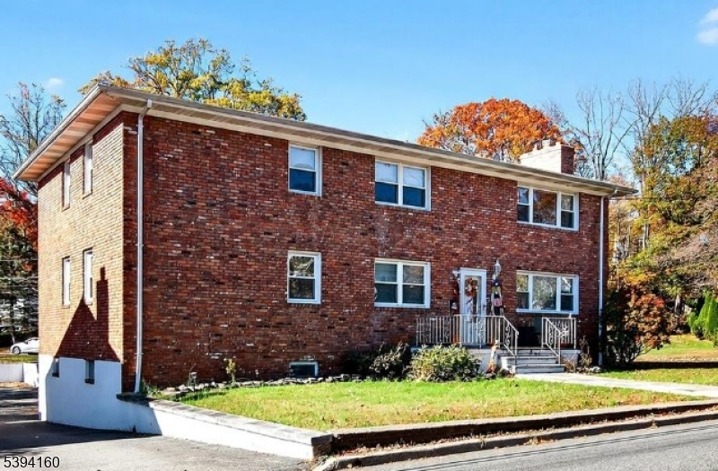 61 Star Lake Road, Unit 2 Bloomingdale, NJ 07403 - Photo 18 of 18 front view of a house with a yard
