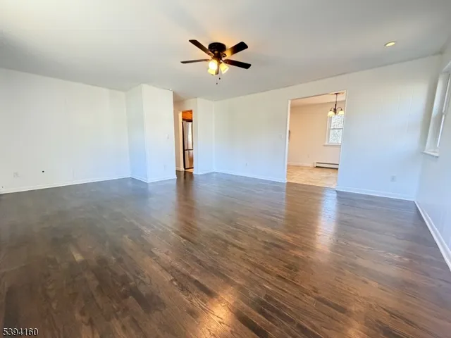 a kitchen with stainless steel appliances granite countertop a sink a stove a refrigerator and a refrigerator