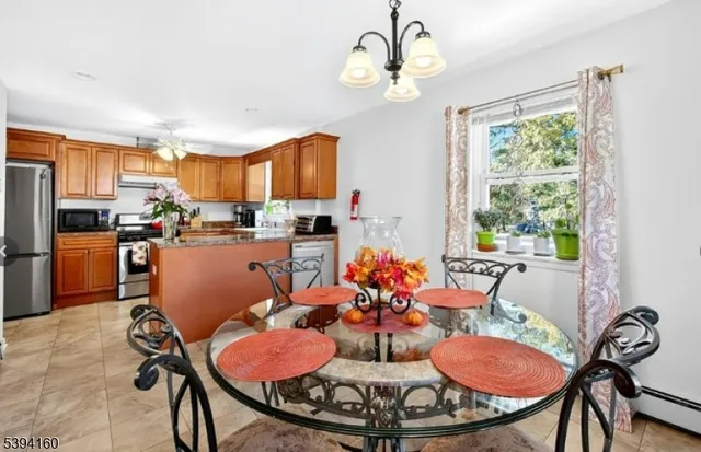 a outdoor dining room with furniture a window and kitchen view