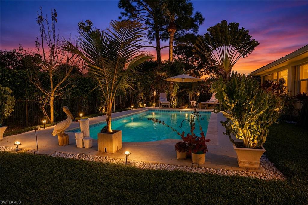 186 Muirfield Circle Naples, FL 34113 - Photo 30 of 36 a view of a park with large trees