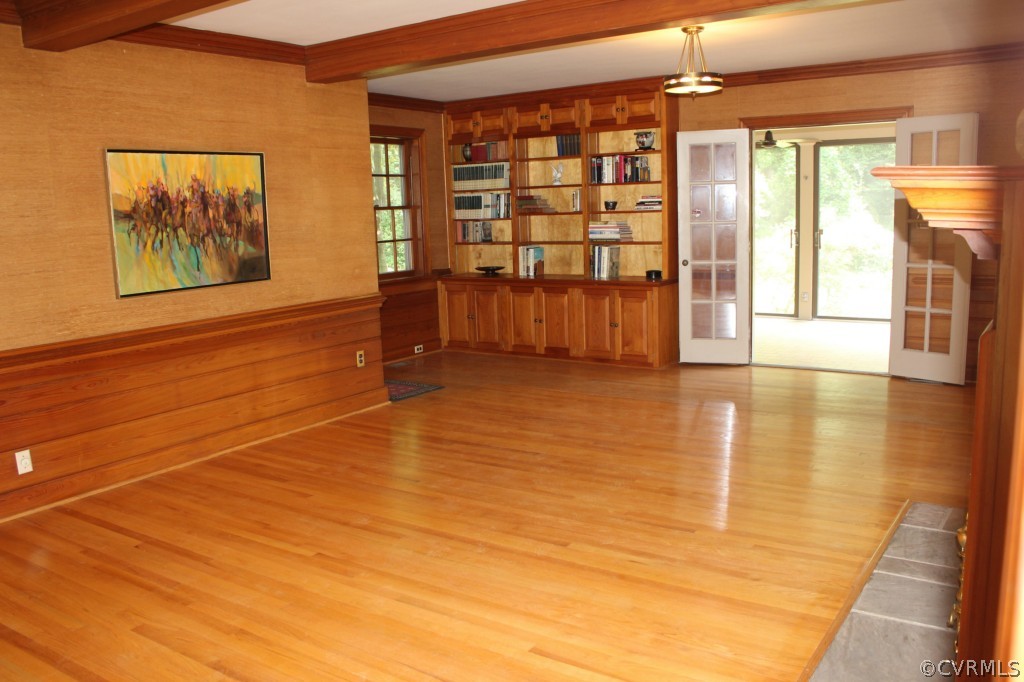 8007 Cameron Road Henrico, VA 23229 - Photo 12 of 24 a view of an empty room with a window and wooden floor