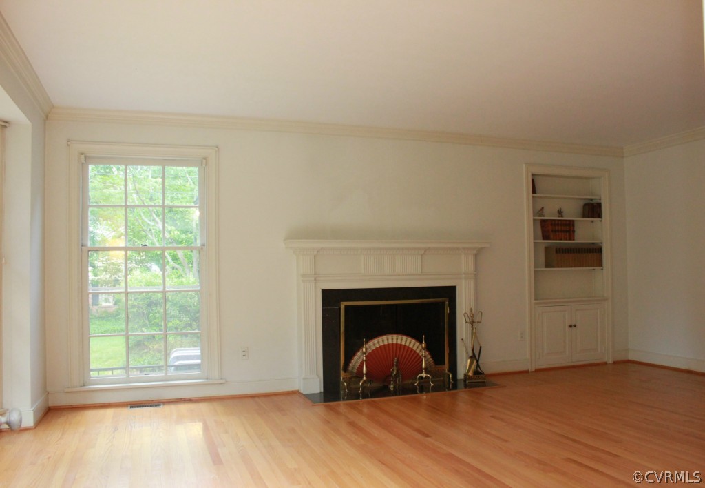 8007 Cameron Road Henrico, VA 23229 - Photo 4 of 24 an empty room with windows and fireplace