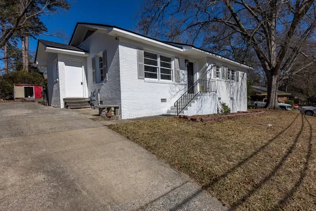 a front view of a house with a yard