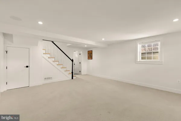 a view of an empty room with stairs