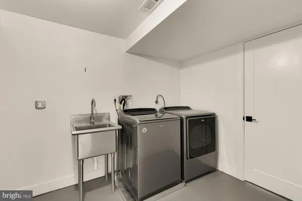 a utility room with washer and dryer