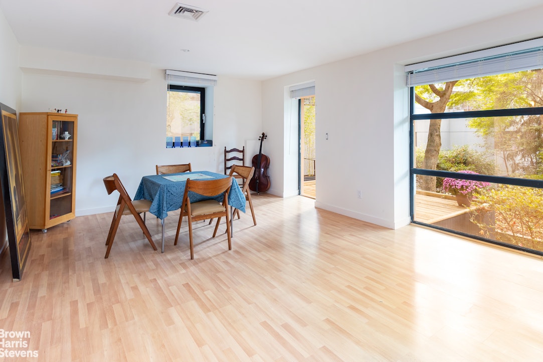 712 Ladd Road Bronx, NY 10471 - Photo 24 of 34 a view of a dining room with furniture and wooden floor