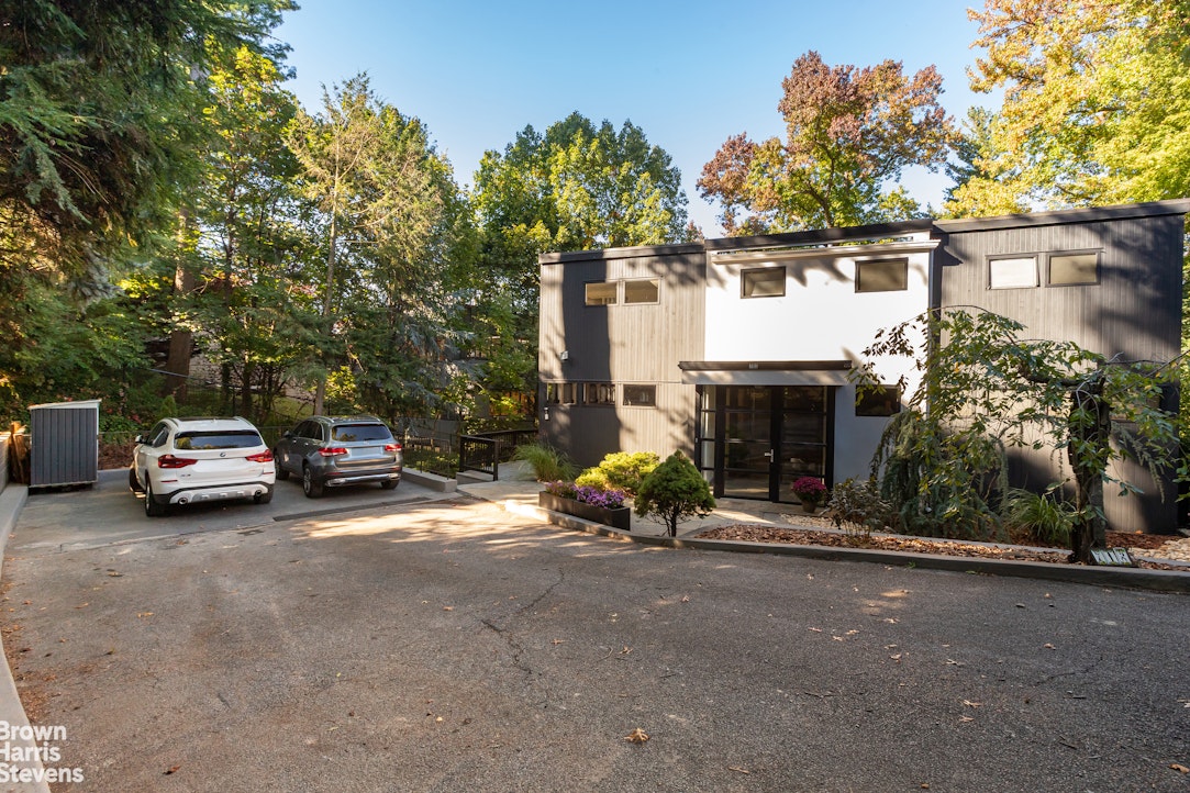712 Ladd Road Bronx, NY 10471 - Photo 28 of 34 a view of a car parked in front of a house
