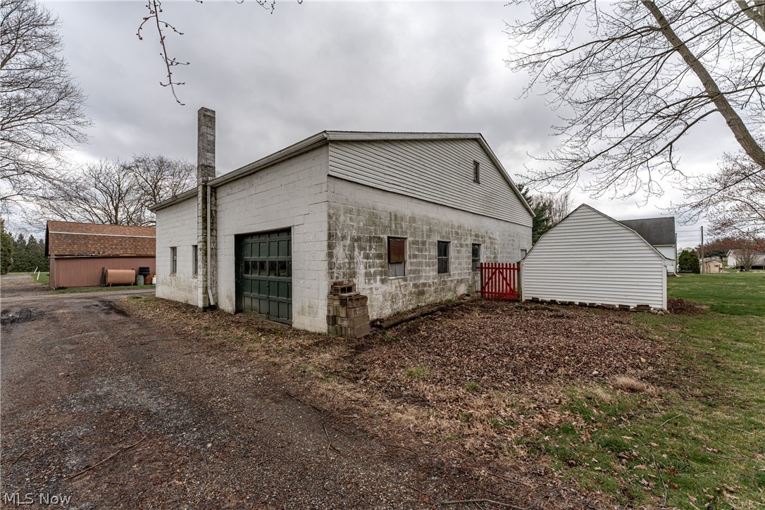 4833 Angling Road Wooster, OH 44691 - Photo 6 of 49 View of side of home featuring a garage