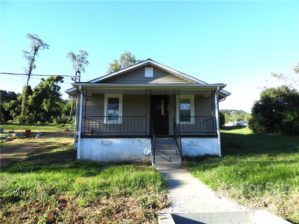 529 Jacktown Road Marion, NC 28752 - Photo 1 of 14 a front view of a house with garden