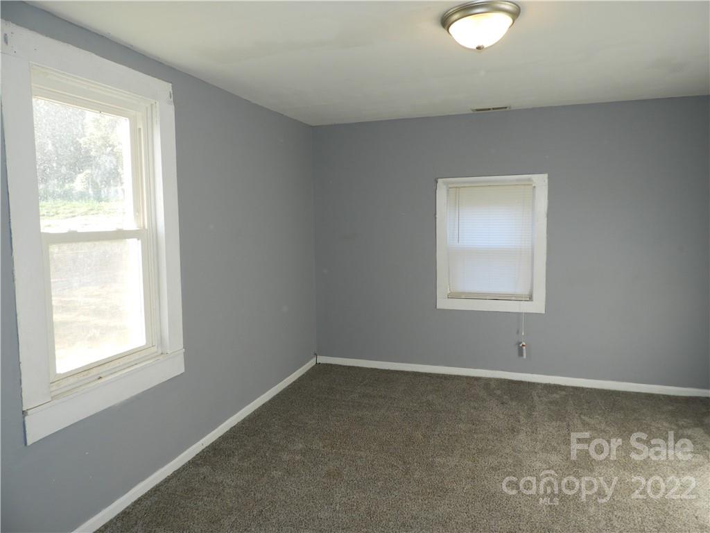 529 Jacktown Road Marion, NC 28752 - Photo 11 of 14 an empty room with a window