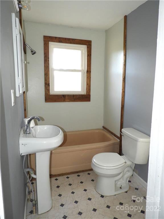 529 Jacktown Road Marion, NC 28752 - Photo 12 of 14 a bathroom with a sink toilet a mirror and shower